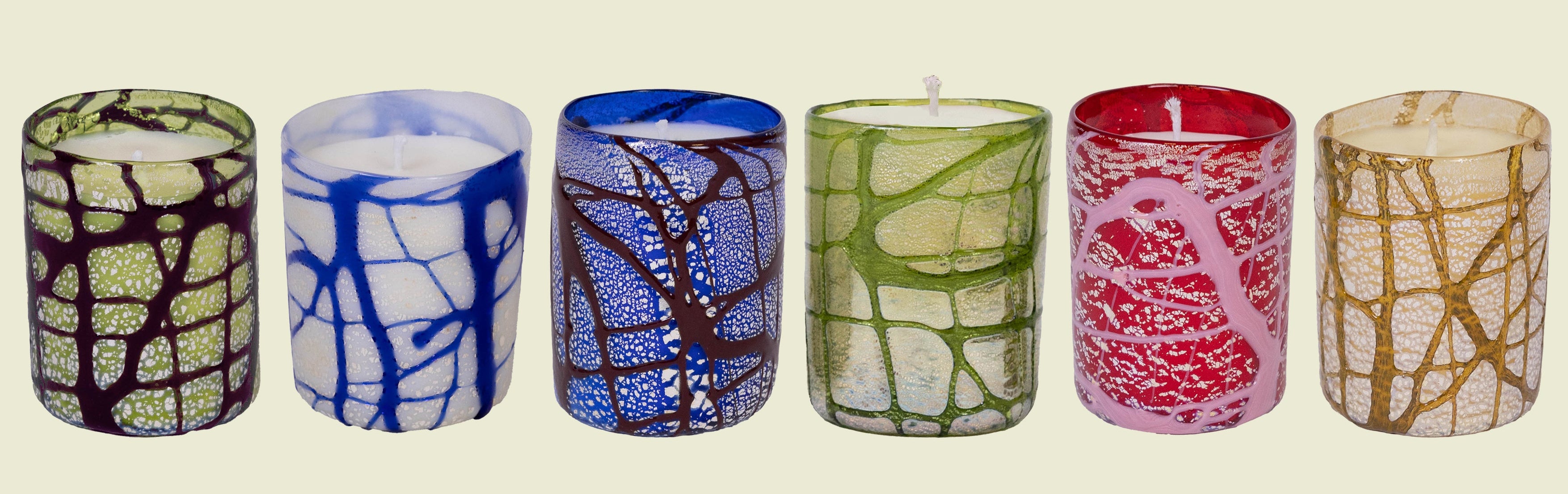 Set of six colorful Venetian glass candles with unique patterns and silver leaf detailing.