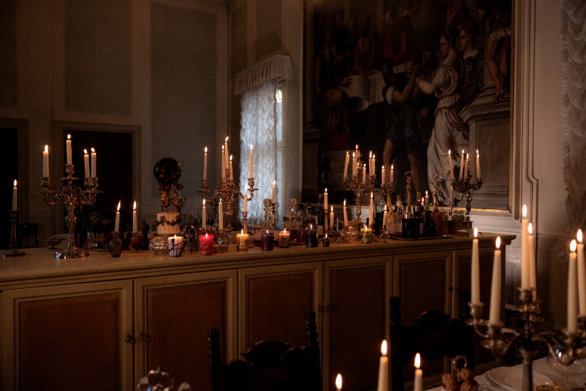 Venetian Salon with ornate candles, hand-made glass candles made in venice and artwork on the wall